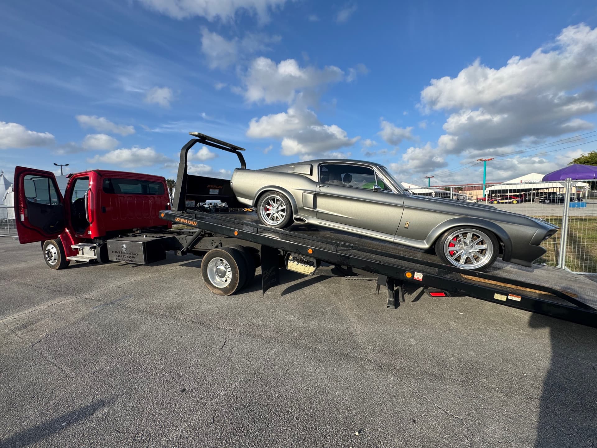 High Solar Towing flatbed transporting a classic Mustang in Delray Beach