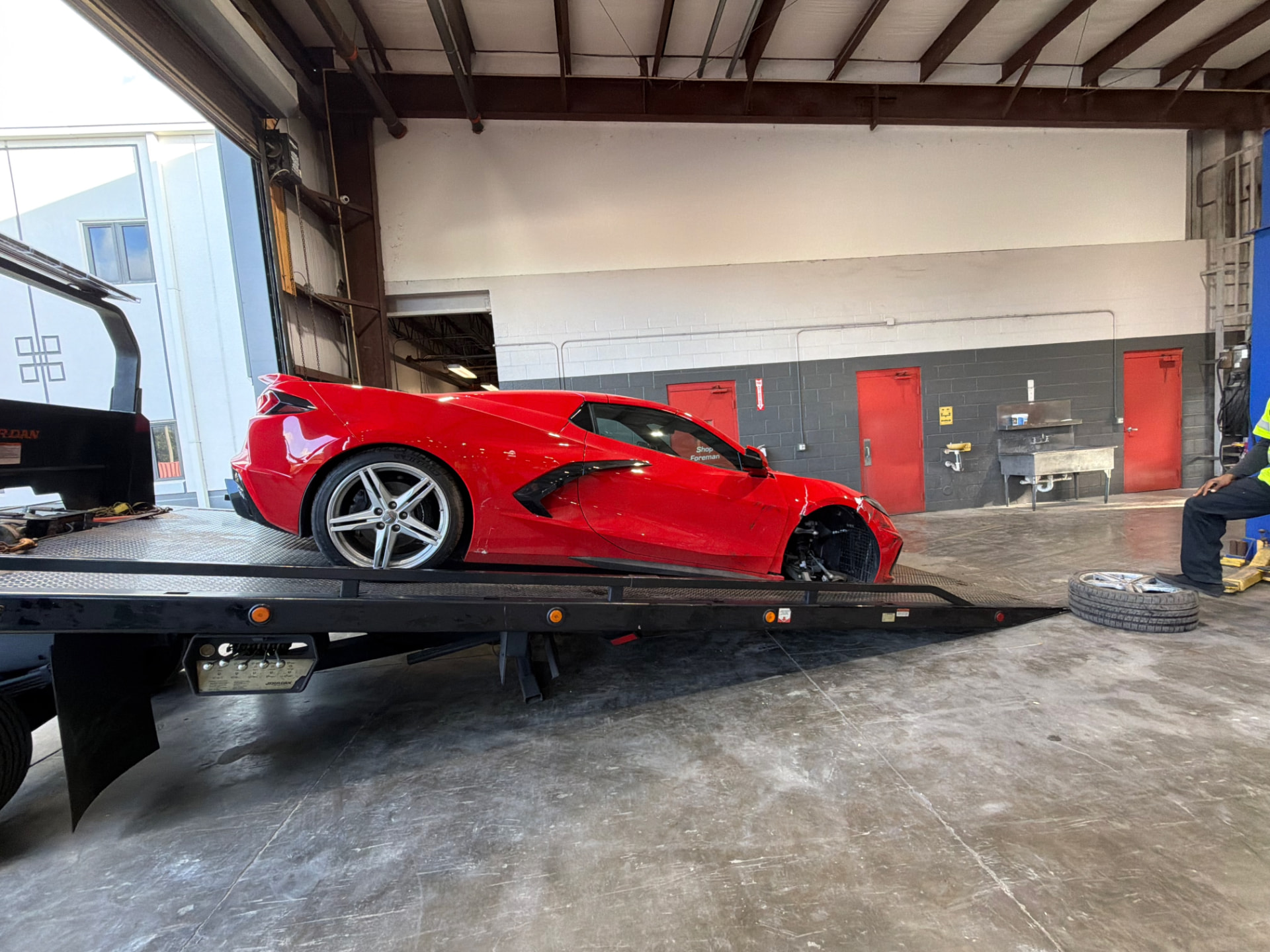 High Solar Towing flatbed carrying a luxury sports car in Delray Beach, FL